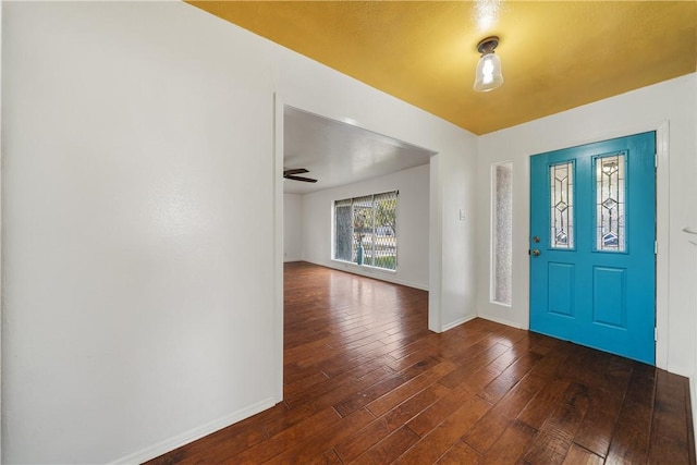 entrance foyer with ceiling fan and dark hardwood / wood-style floors