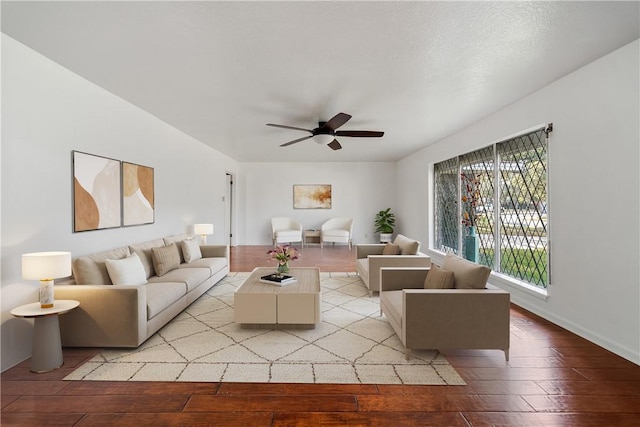 living room with ceiling fan and light hardwood / wood-style flooring