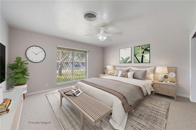 bedroom with light carpet and ceiling fan