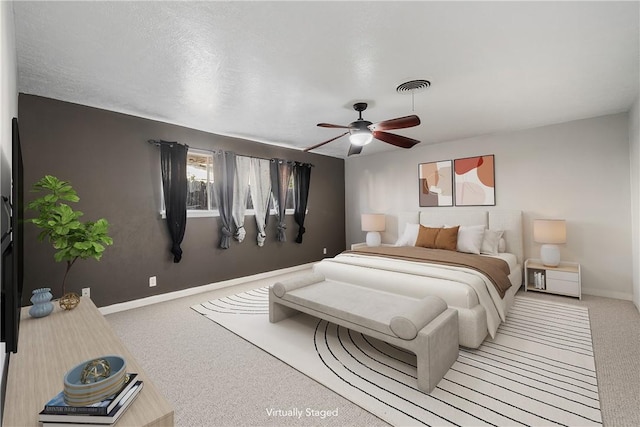 bedroom featuring ceiling fan and light colored carpet