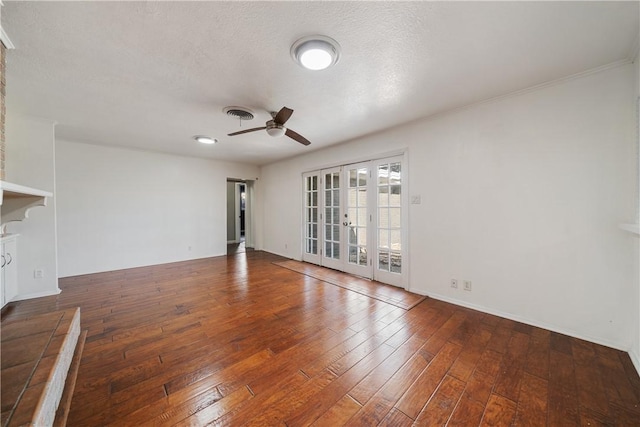 unfurnished room featuring hardwood / wood-style flooring, ceiling fan, a textured ceiling, and french doors