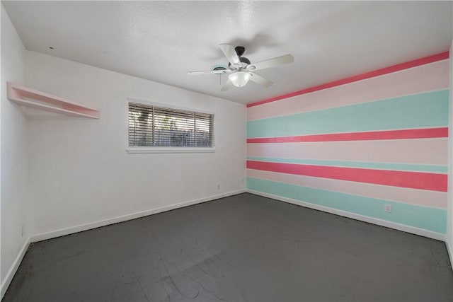 spare room featuring ceiling fan