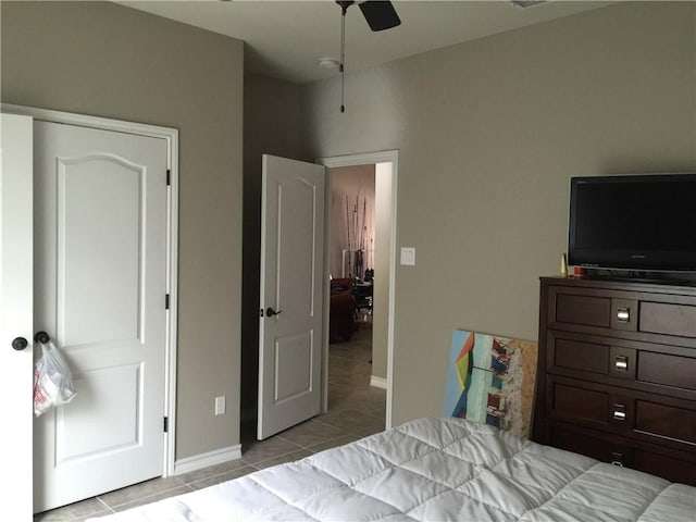 15533 Dyna St, Corpus Christi, TX 78418 - bedroom with light tile patterned flooring, baseboards, and a ceiling fan