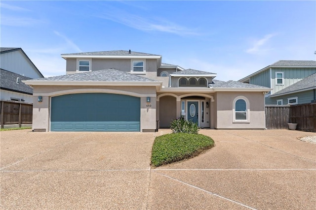 650 S Bay St, Aransas Pass, TX 78336 - view of front of property with driveway, stucco siding, and a garage