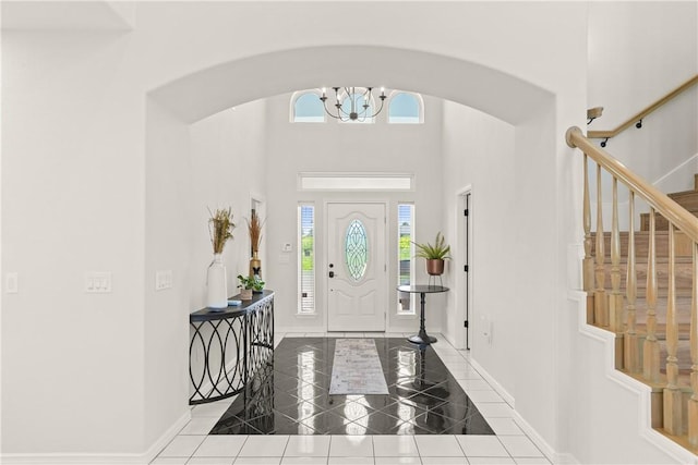 650 S Bay St, Aransas Pass, TX 78336 - foyer featuring arched walkways, healthy amount of natural light, stairs, and a towering ceiling