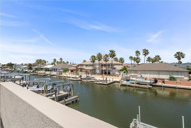 650 S Bay St, Aransas Pass, TX 78336 - dock area with boat lift, a water view, and a residential view