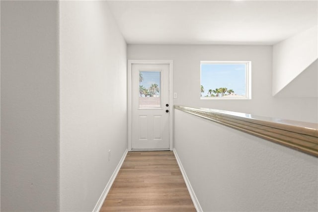 650 S Bay St, Aransas Pass, TX 78336 - corridor featuring light wood finished floors and baseboards