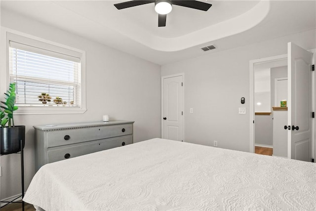 650 S Bay St, Aransas Pass, TX 78336 - bedroom with ceiling fan and a tray ceiling