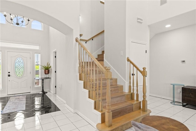 650 S Bay St, Aransas Pass, TX 78336 - foyer entrance featuring a towering ceiling, plenty of natural light, arched walkways, tile patterned floors, and stairway