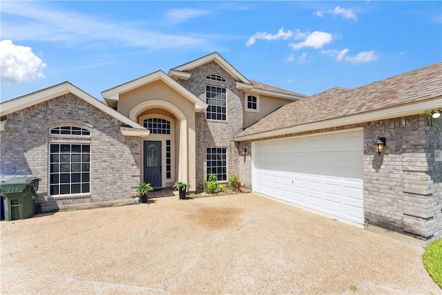 6530 Picante Dr, Corpus Christi, TX 78414 - view of front of property featuring concrete driveway and a garage