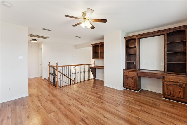 6530 Picante Dr, Corpus Christi, TX 78414 - spare room featuring built in desk, light wood finished floors, ceiling fan, and a smoke detector