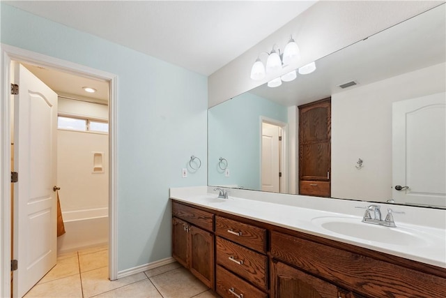 6530 Picante Dr, Corpus Christi, TX 78414 - bathroom featuring double vanity and tile patterned floors