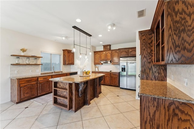 6530 Picante Dr, Corpus Christi, TX 78414 - kitchen with open shelves, stainless steel fridge, backsplash, light tile patterned flooring, and recessed lighting
