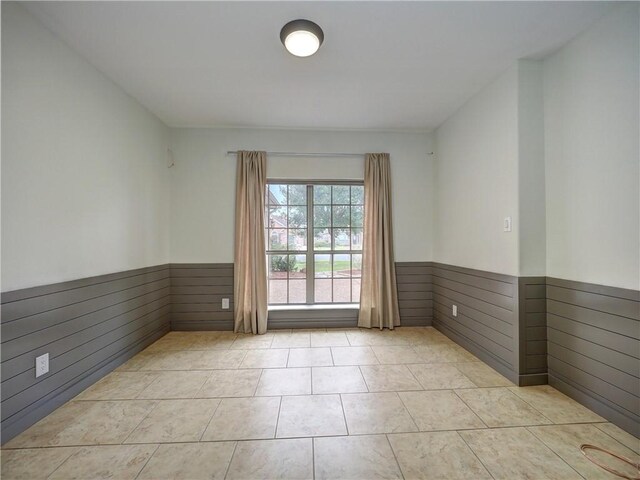 6134 Strasbourg Dr, Corpus Christi, TX 78414 - tiled spare room with wainscoting and wood walls