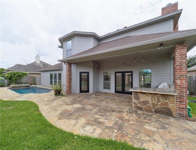 6134 Strasbourg Dr, Corpus Christi, TX 78414 - rear view of property with a patio, french doors, a fenced backyard, and a chimney