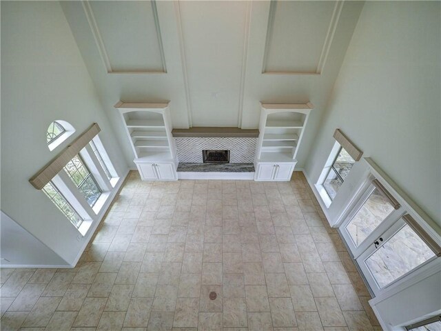 6134 Strasbourg Dr, Corpus Christi, TX 78414 - unfurnished living room with a fireplace with raised hearth and a high ceiling
