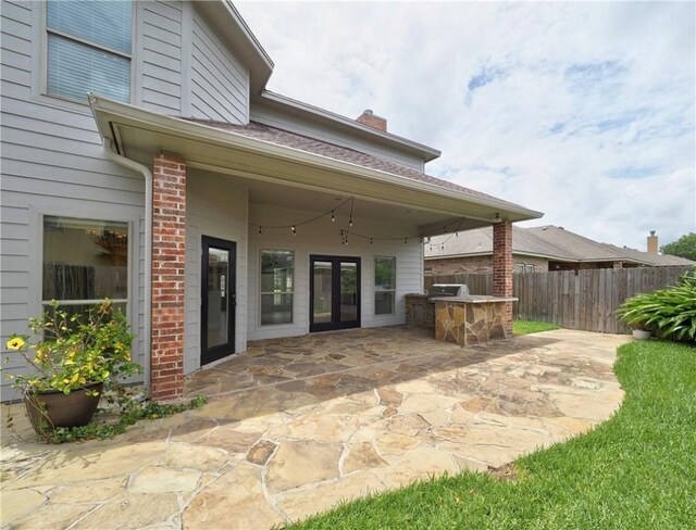 6134 Strasbourg Dr, Corpus Christi, TX 78414 - view of patio with an outdoor kitchen and french doors