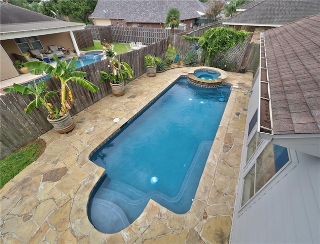 6134 Strasbourg Dr, Corpus Christi, TX 78414 - view of pool with a patio area, a pool with connected hot tub, and a fenced backyard