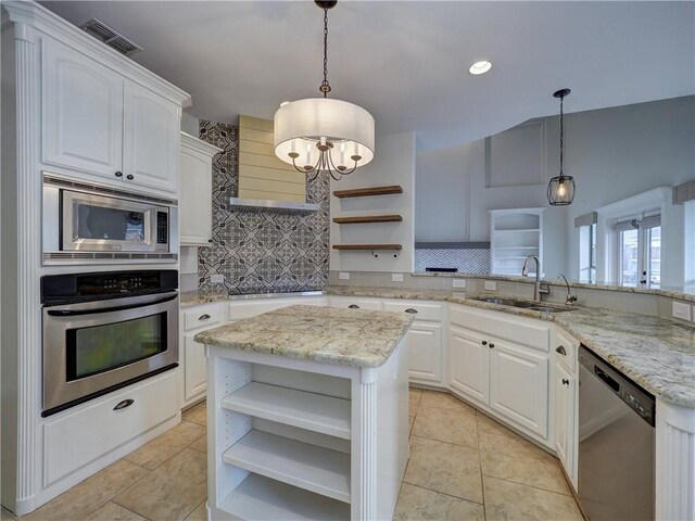 6134 Strasbourg Dr, Corpus Christi, TX 78414 - kitchen with open shelves, stainless steel appliances, exhaust hood, a chandelier, and white cabinetry