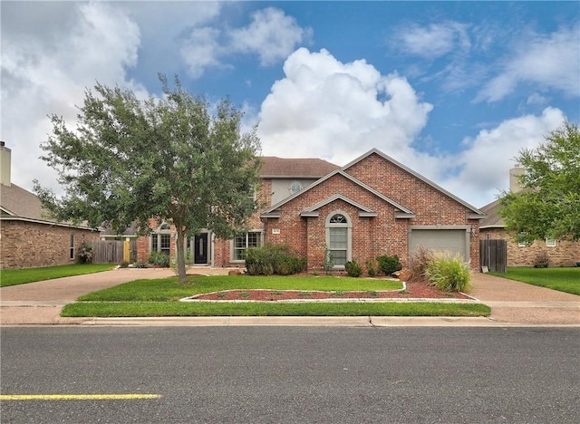 6134 Strasbourg Dr, Corpus Christi, TX 78414 - view of front of home with driveway, a garage, and brick siding