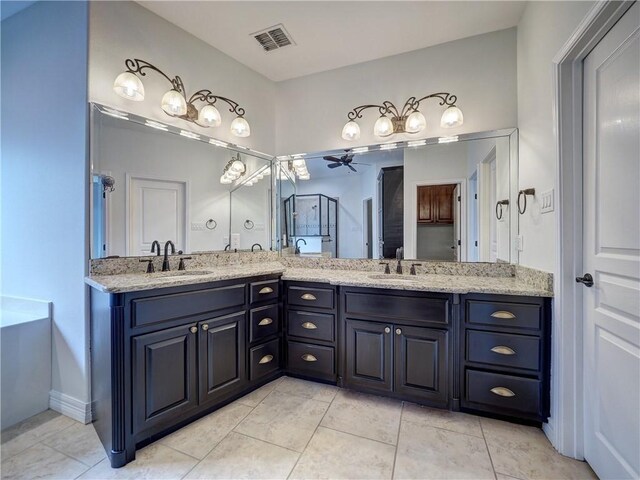 6134 Strasbourg Dr, Corpus Christi, TX 78414 - bathroom featuring double vanity, a shower stall, ceiling fan, and tile patterned floors