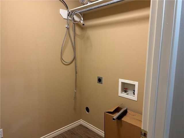 clothes washing area with dark hardwood / wood-style flooring, electric dryer hookup, and hookup for a washing machine