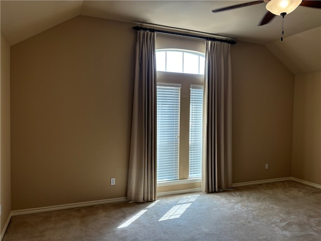 bonus room featuring ceiling fan, light colored carpet, and vaulted ceiling