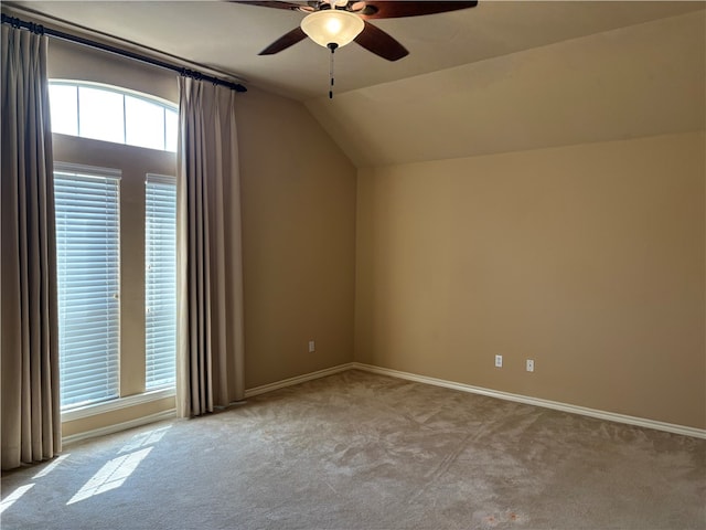 additional living space with light carpet, ceiling fan, and vaulted ceiling