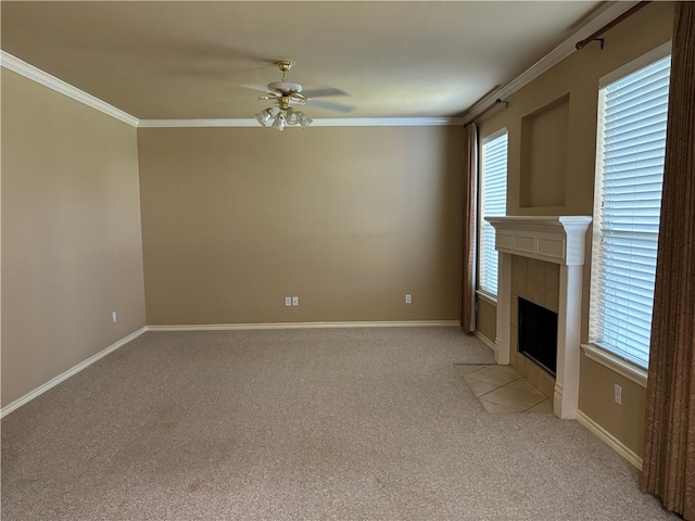 unfurnished living room with plenty of natural light, light carpet, and a tile fireplace