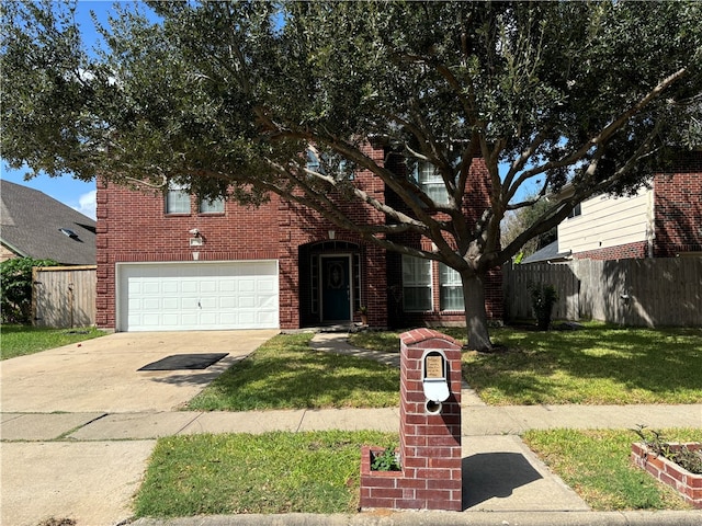 view of front of property with a garage and a front lawn