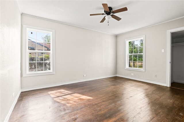 1367 Normandy Dr, Corpus Christi, TX 78415 - unfurnished bedroom featuring wood finished floors, crown molding, baseboards, ceiling fan, and a spacious closet