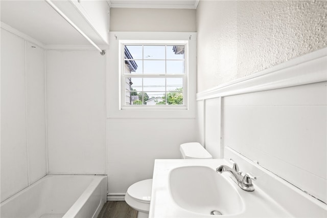 1367 Normandy Dr, Corpus Christi, TX 78415 - bathroom featuring toilet, a sink, wood finished floors, and crown molding