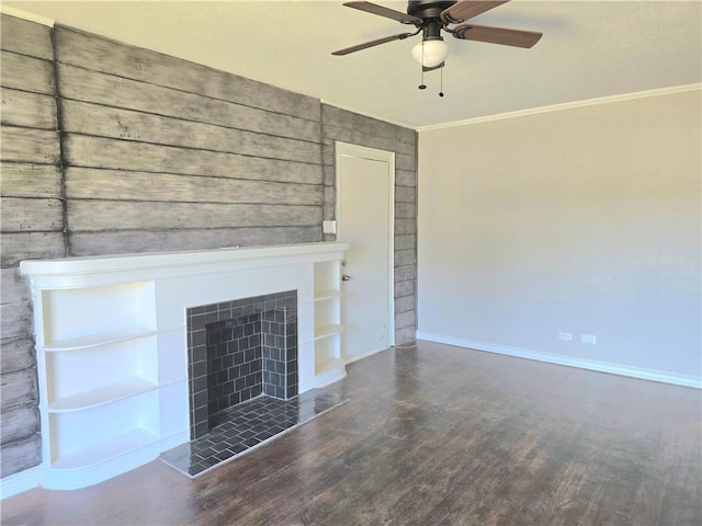 1367 Normandy Dr, Corpus Christi, TX 78415 - unfurnished living room with crown molding, wood finished floors, a ceiling fan, baseboards, and a tile fireplace