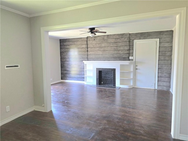 1367 Normandy Dr, Corpus Christi, TX 78415 - unfurnished living room featuring ceiling fan, wood finished floors, a fireplace, crown molding, and baseboards