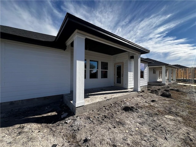 view of side of home with a patio