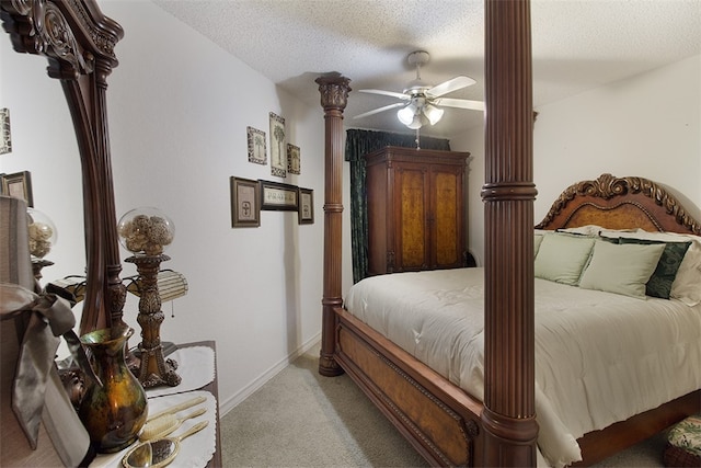 4445 Cedar Pass Dr Unit 103, Corpus Christi, TX 78413 - bedroom with light colored carpet, a textured ceiling, a ceiling fan, and decorative columns