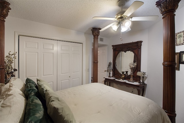 4445 Cedar Pass Dr Unit 103, Corpus Christi, TX 78413 - bedroom featuring a closet, a ceiling fan, ornate columns, and a textured ceiling