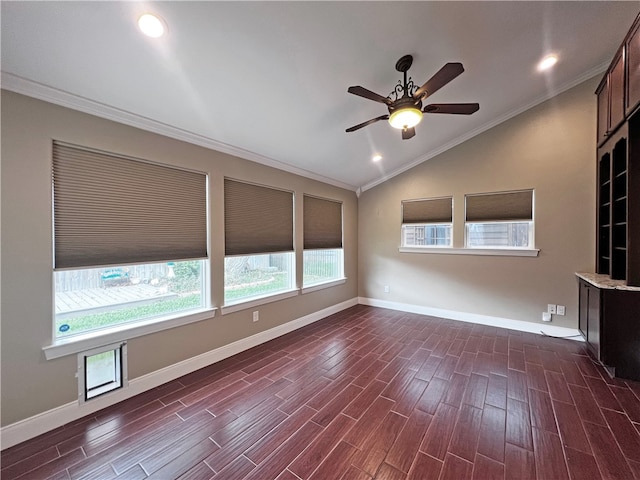 interior space with ornamental molding, lofted ceiling, ceiling fan, and dark wood-type flooring