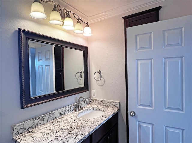 bathroom featuring vanity and crown molding