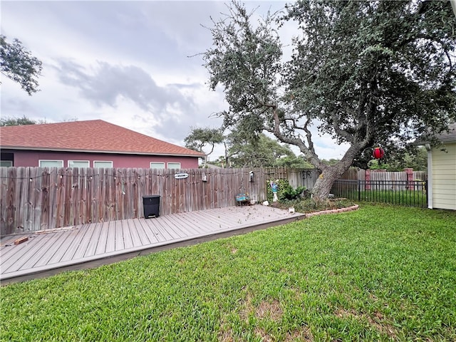 view of yard featuring a wooden deck