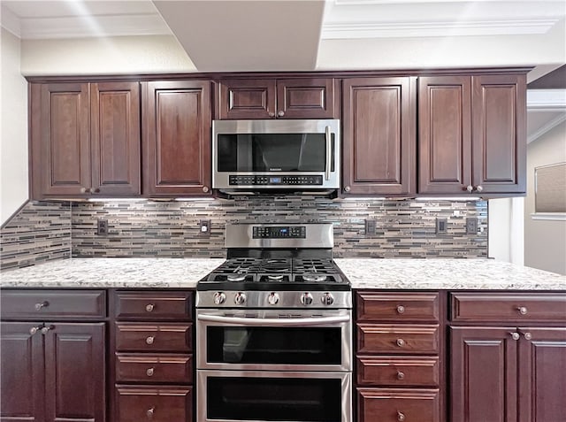 kitchen with crown molding, stainless steel appliances, and tasteful backsplash