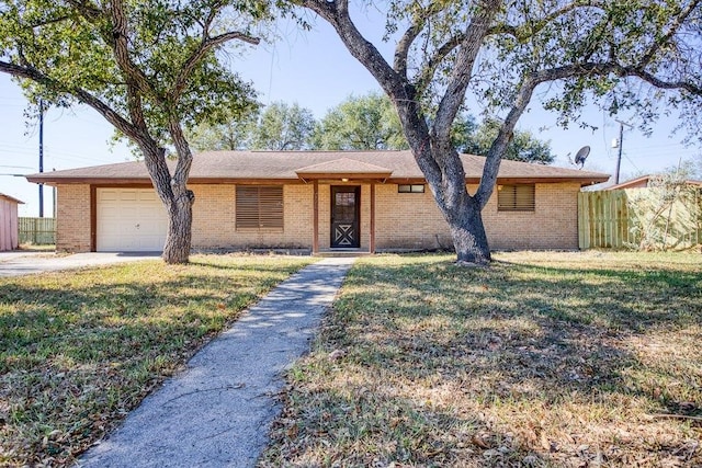 ranch-style house with a front yard and a garage