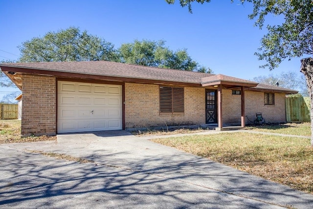 ranch-style home with a front yard and a garage