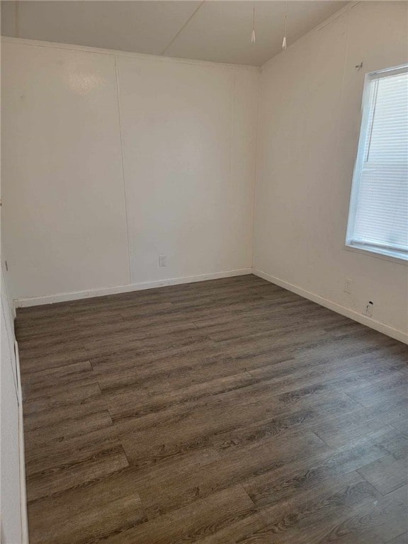 spare room featuring dark hardwood / wood-style floors