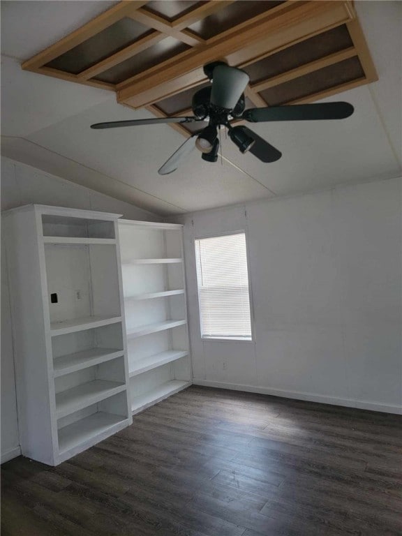 interior space with ceiling fan, dark hardwood / wood-style flooring, and vaulted ceiling