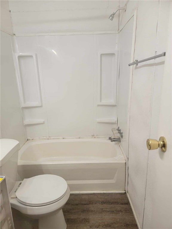 full bathroom featuring vanity, wood-type flooring, bathtub / shower combination, and toilet