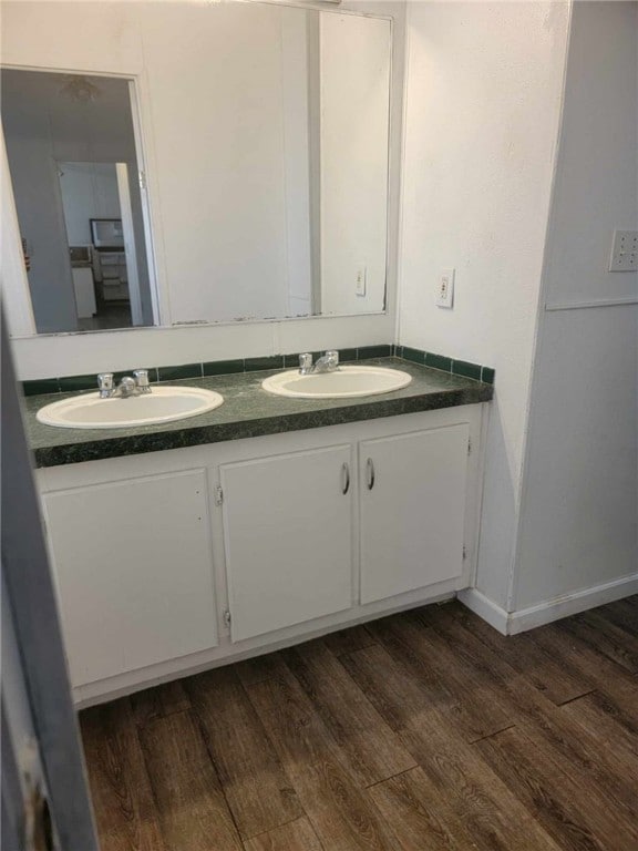 bathroom featuring hardwood / wood-style floors and vanity