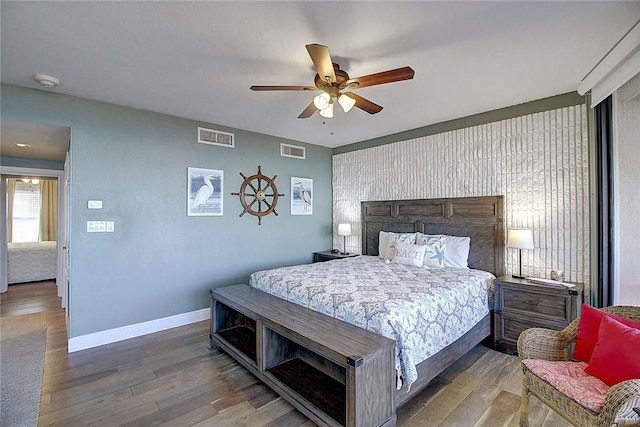 bedroom featuring hardwood / wood-style flooring and ceiling fan