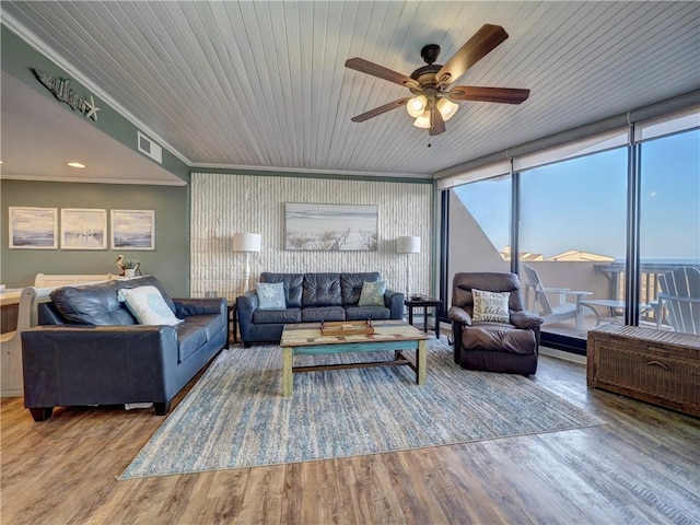 living room with expansive windows, wood ceiling, ceiling fan, crown molding, and hardwood / wood-style flooring