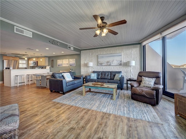 living room with wooden ceiling, ceiling fan, crown molding, and light hardwood / wood-style floors